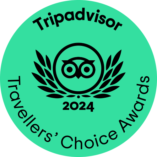 A circular green logo featuring the TripAdvisor owl character and the text TripAdvisor Traveller's Choice 2024 awards
